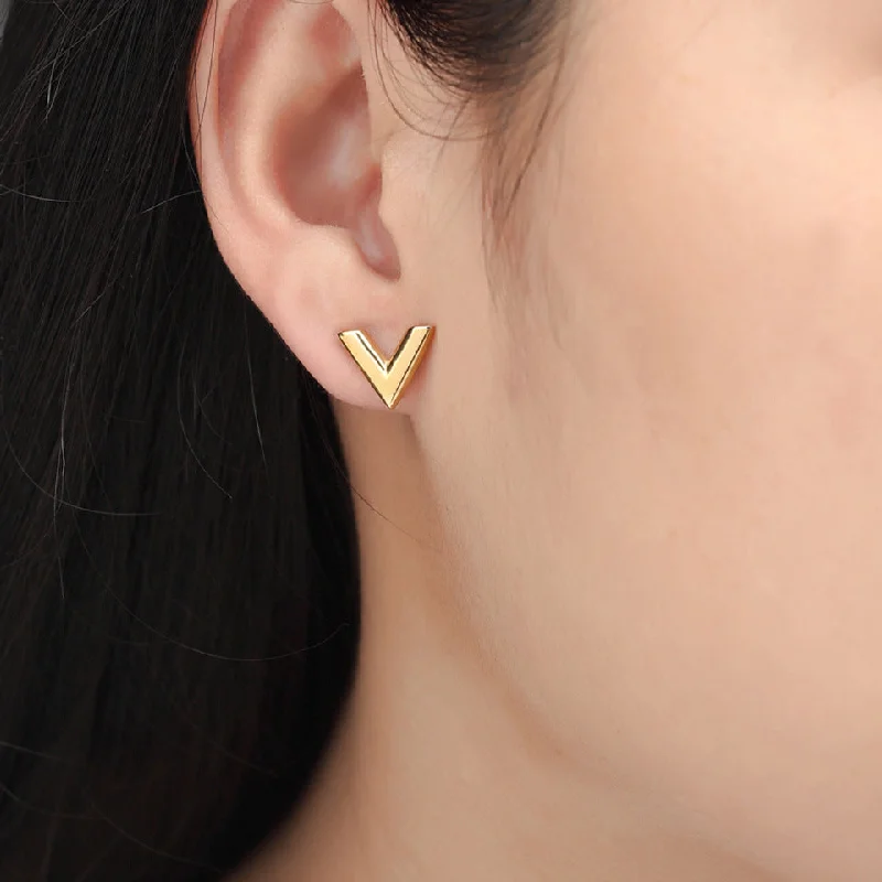 Gold stud earrings